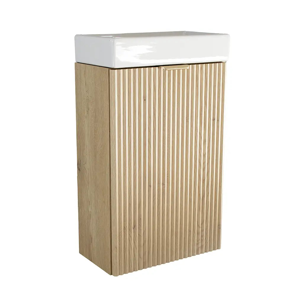 Waschtischunterschrank 40 cm Willy in Eiche Cremona mit geriffelter Tür, Metallgriff und passendem Keramikwaschbecken – kompakt und stilvoll fürs Bad.