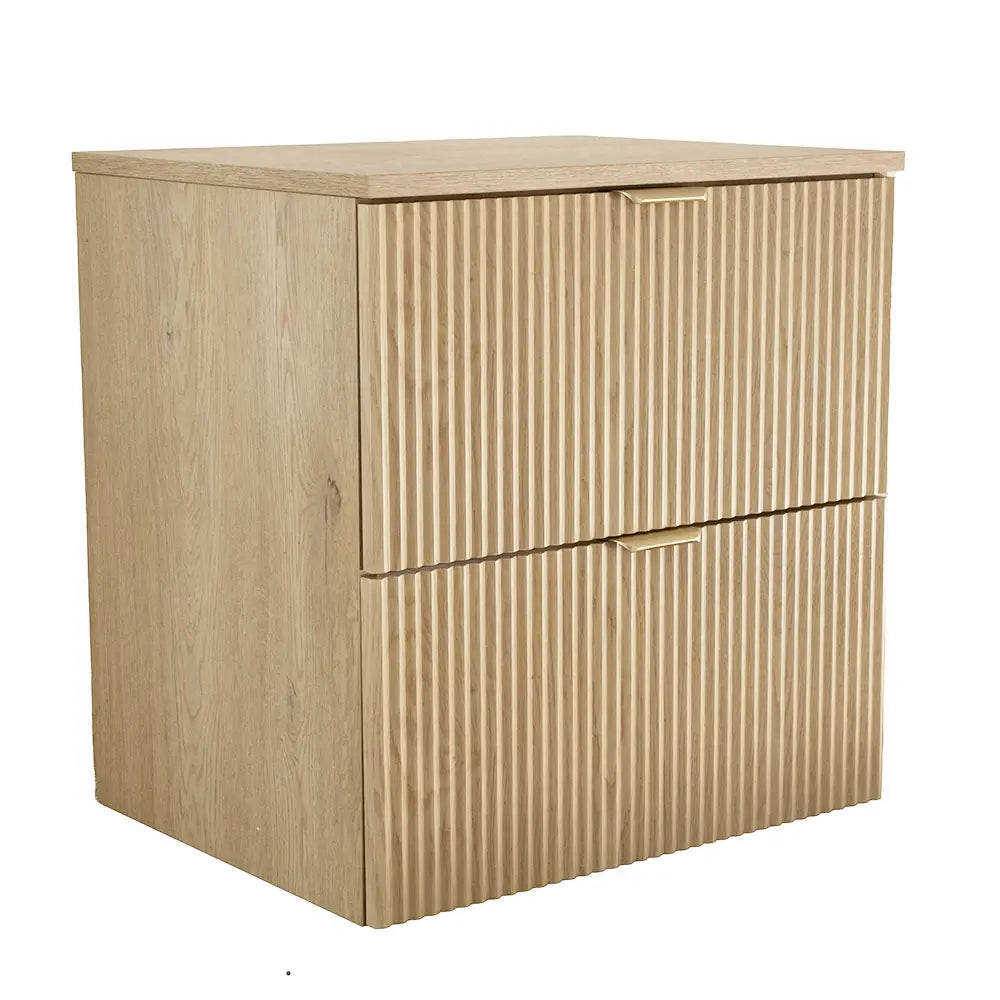 Frontansicht des Waschtischunterschranks 60 cm Willy in Eiche Cremona mit geriffelten Fronten, zwei Schubladen und goldenen Griffen.